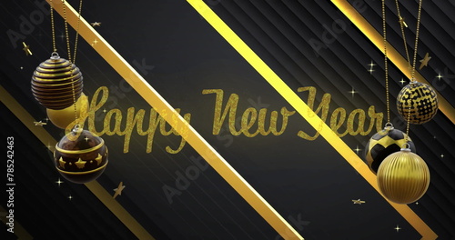 Image of happy new year text with baubles and stars hanging on abstract background