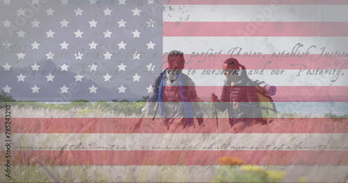 Image of american flag and text moving over couple hiking