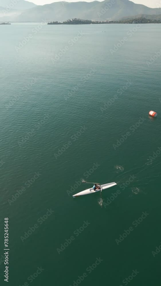 Sport Canoe rowing on tranquil water, Aerial view.rowing beach sprint race . High quality 4k footage Sport Canoe rowing on tranquil water, Aerial view.rowing beach sprint race . High quality 4k footage