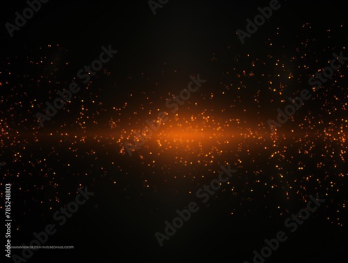Orange abstract glowing bokeh lights on a black background with space for text or product display