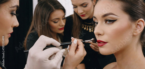 Makeup Artist Creating a Look for a Fashion Show. array of brushes and palettes at hand, meticulously creates a stunning look for a model at a fashion show. The concentration and creativity 