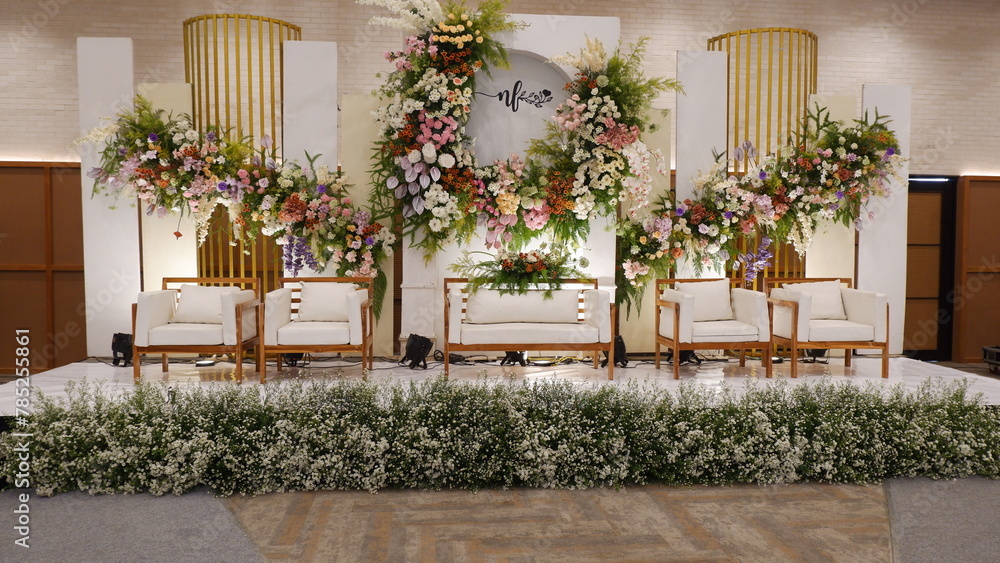 a photo of a beautiful bright wedding stage indonesian