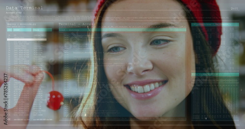 Image of data processing against close up of a caucasian woman holding a cherry photo
