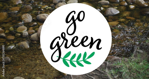 Image of go green text over river and rocks