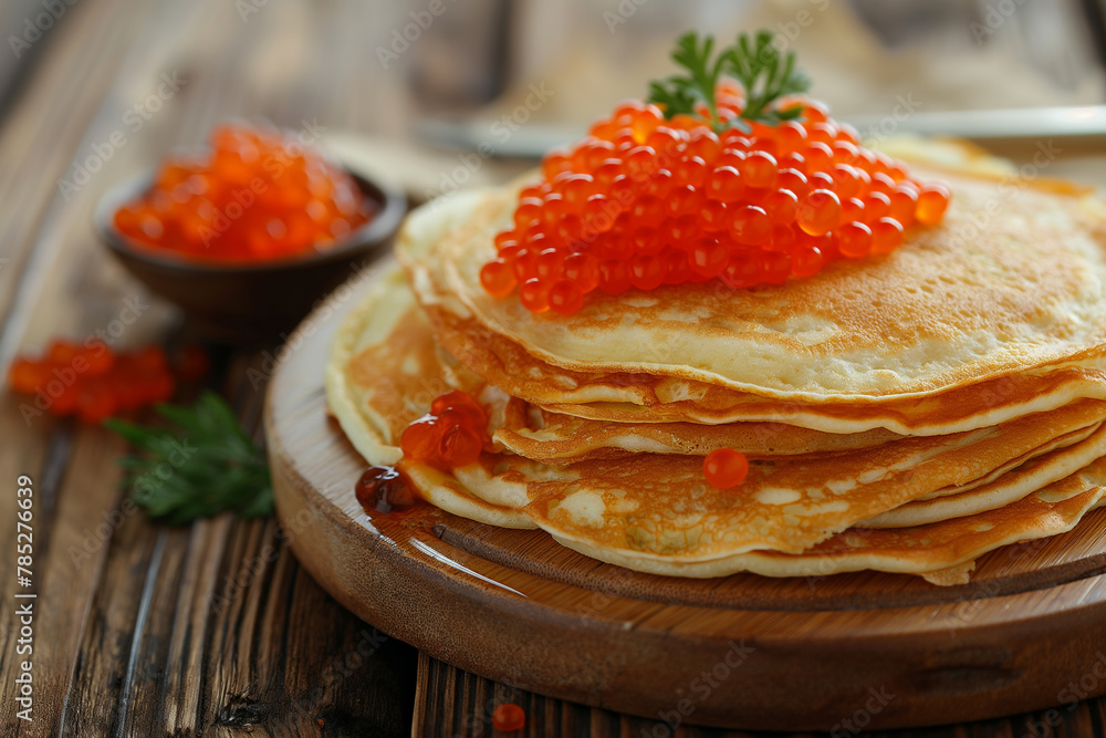 Delicious pancakes with red caviar on a wooden table, closeup Delicious pancakes with red caviar on a wooden table, closeup