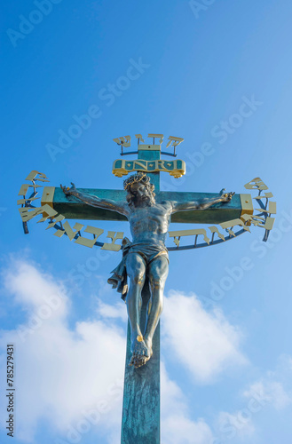 Statuary of the Holy Crucifix and Calvary on Charles Bridge, in Prague, Czech Republic, in sunny day