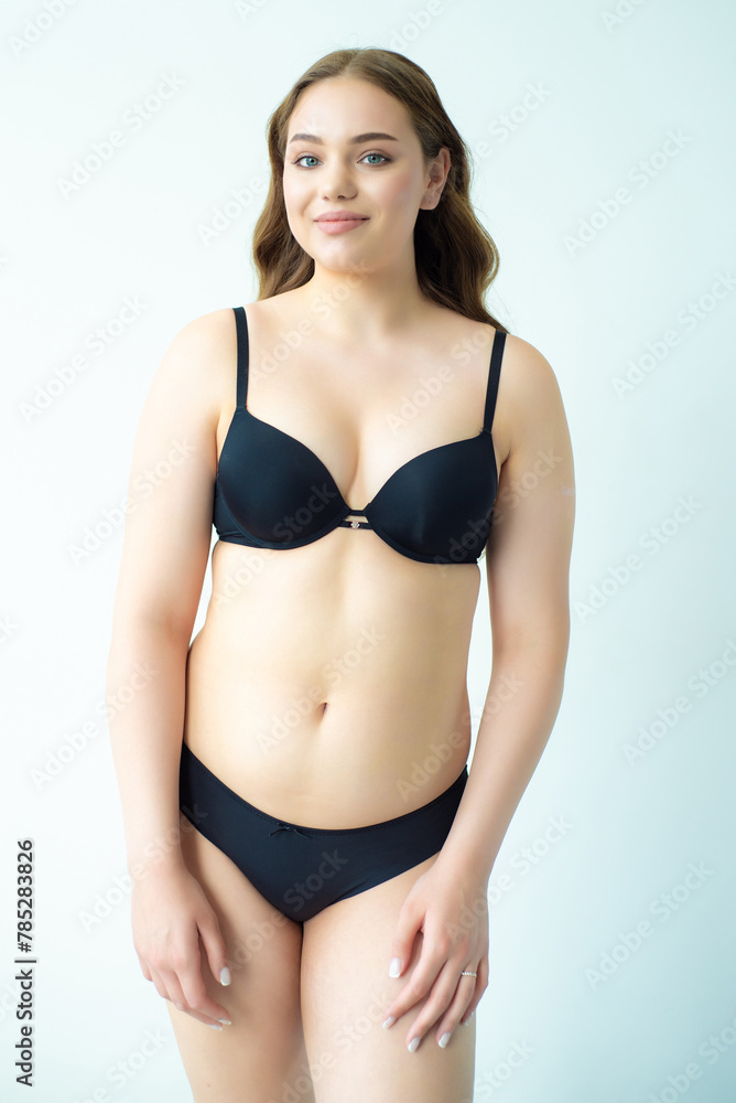 young woman with beautiful hair in black lingerie posing isolated on white background. Model test, snap, polaroid young woman with beautiful hair in black lingerie posing isolated on white background. Model test, snap, polaroid