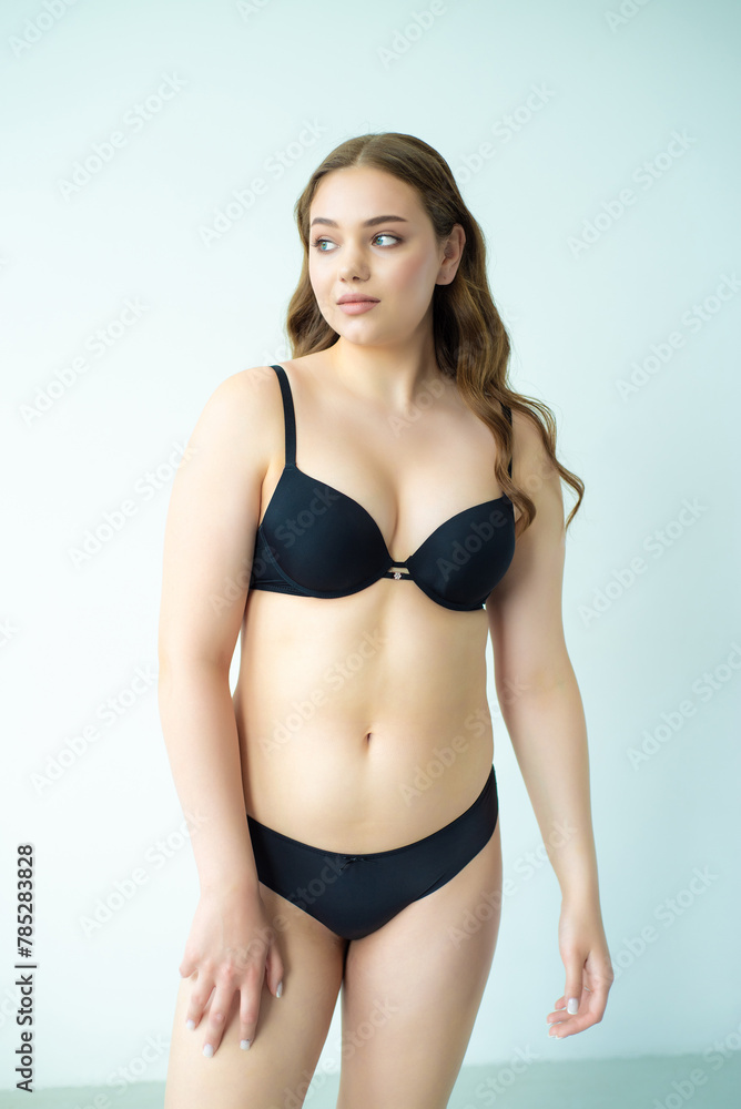 young woman with beautiful hair in black lingerie posing isolated on white background. Model test, snap, polaroid young woman with beautiful hair in black lingerie posing isolated on white background. Model test, snap, polaroid