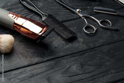 Professional Barber Tools Laid Out Dark Wooden Surface