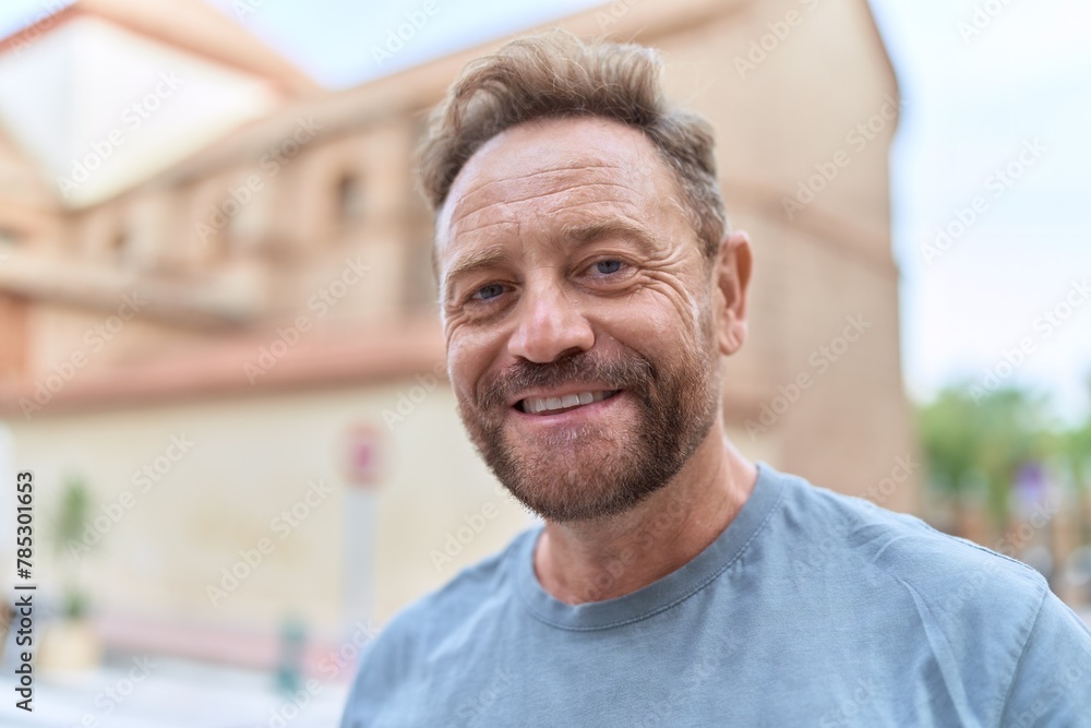 Middle age man smiling confident standing at street Middle age man smiling confident standing at street
