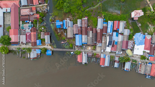 View of a residential village on the riverbank of South Kalimantan from a drone during the day © A Denny Syahputra