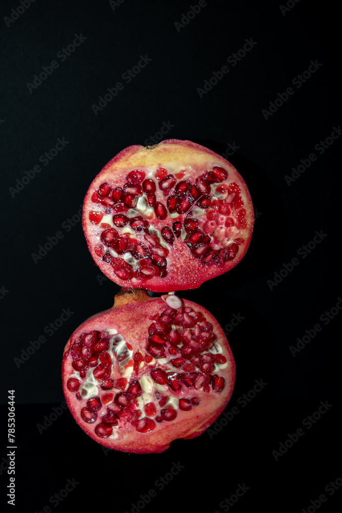 pomegranate on black background pomegranate on black background
