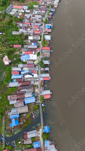 View of a residential village on the riverbank of South Kalimantan from a drone during the day