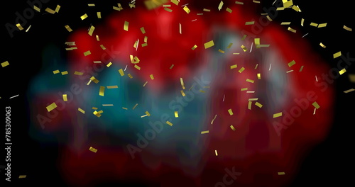 Image of gold confetti floating over out of focus red and black background