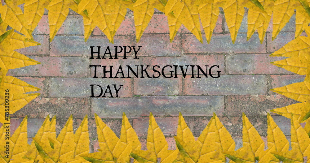 Fototapeta premium Image of happy thanksgiving day text over bricks with autumn leaves