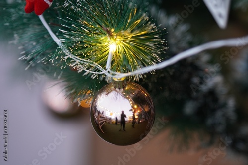 closeup of decorative balls hanging on christmas tree