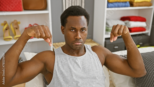 African man disapproving with thumbs down in a modern bedroom