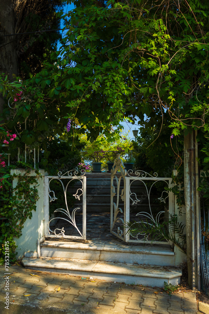 Gates and wickets, iron bars and forged patterns on the doors. City views on the streets, public place in Turkey, on a summer sunny day Gates and wickets, iron bars and forged patterns on the doors. City views on the streets, public place in Turkey, on a summer sunny day