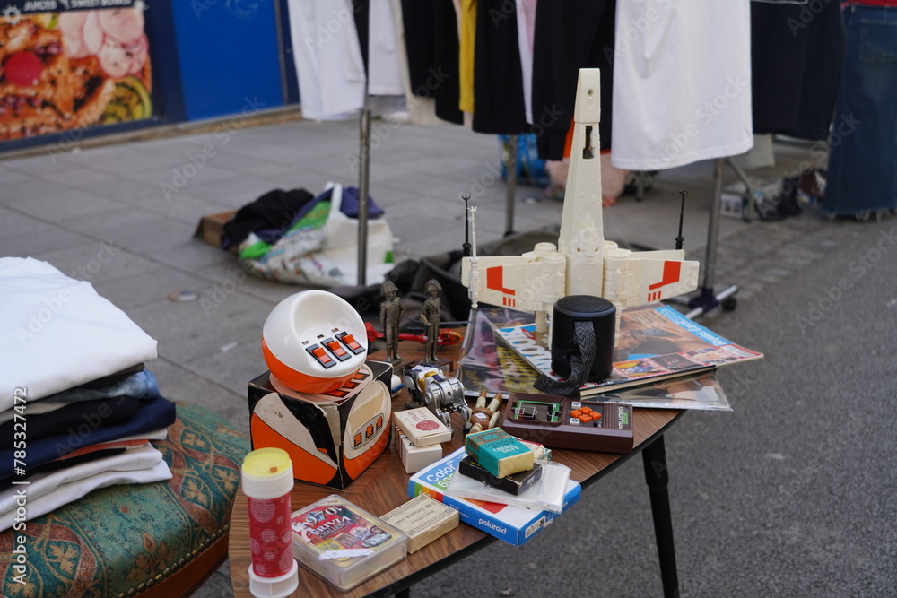 Naklejka premium Paris France , 04 04 2024 : vintage toys and second hand antiques at the flea market in Paris