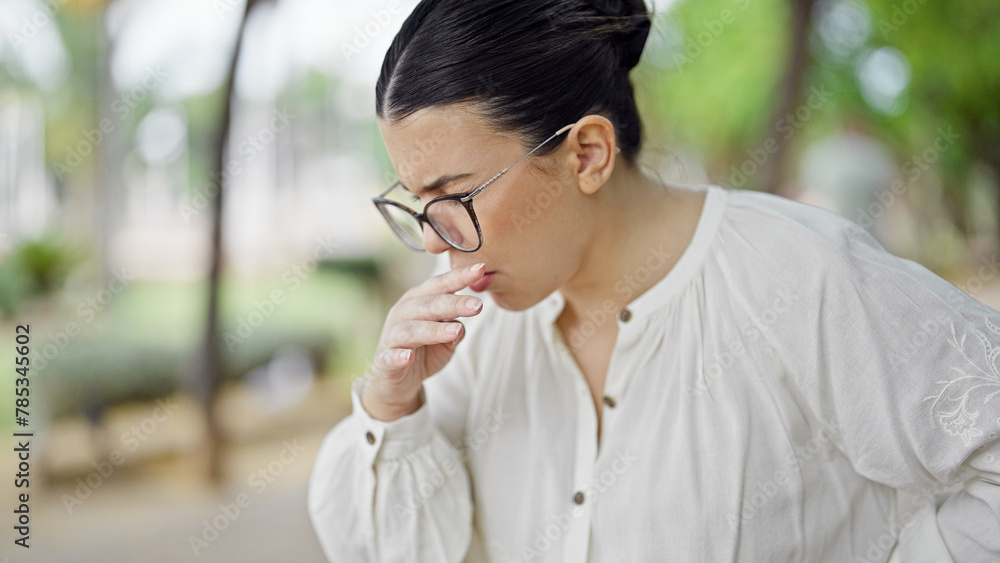 Young beautiful hispanic woman with pollen allergy at the park Young beautiful hispanic woman with pollen allergy at the park