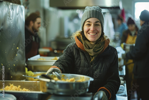 A smiling volunteer serving food at a shelter photo
