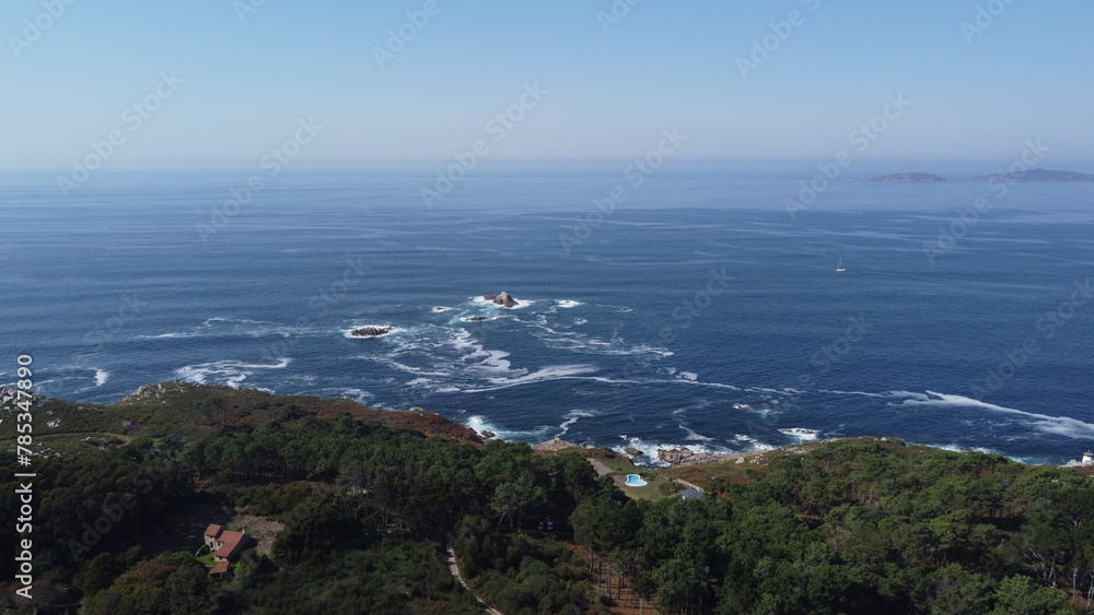Lush green forest meets rocky shoreline in a captivating coastal landscape, offering the perfect balance of nature's beauty Lush green forest meets rocky shoreline in a captivating coastal landscape, offering the perfect balance of nature's beauty