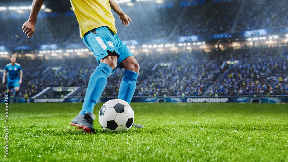 Fototapeta premium Aesthetic Shot Of Athletic Hispanic Footballer Shooting A Penalty Kick On Stadium With Crowd Cheering. Player Scoring a Goal At International Soccer Championship Final Match With Fans On Tribune