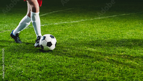 Close Up On Legs Of Professional Football Player Dribbling With A Ball During International Soccer Championship On National Arena. Athlete Running To Score A Winning Goal In Final Match On Stadium. © Gorodenkoff