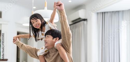 Asian love family father and daughter enjoying a carefree moment  strength and happiness as he lifts his young daughter, childhood, joy, leisure, parenting and home activities, Father day