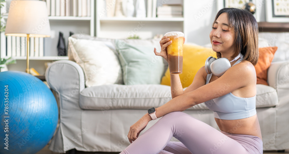 Portrait of sport slim fit strength asian woman training in sportswear relax and practicing yoga, fitness, exercise, wellness, workout, sport at home.Diet concept.Fitness and healthy lifestyle Portrait of sport slim fit strength asian woman training in sportswear relax and practicing yoga, fitness, exercise, wellness, workout, sport at home.Diet concept.Fitness and healthy lifestyle