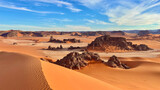 Scenic view of sandy dunes in a sunny desert