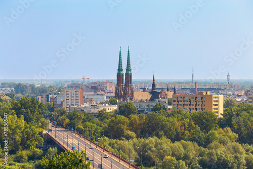 Cityscape - top view of the Silesian-Dabrowa Bridge over the Vistula River and the neighbourhood of Old Praga on the eastern shore, in center of Warsaw, Poland photo