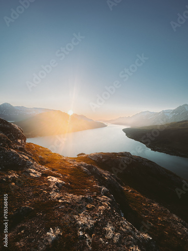 Sunset landscape in Norway mountains and fjord aerial view travel beautiful destinations Lyngen Alps scenery scandinavian northern nature summer season midnight sun