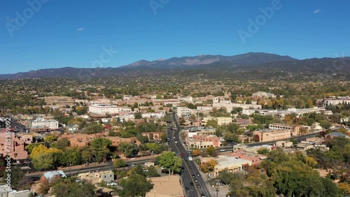 Beautiful drone aerial view of the historic city center of Santa Fe, capital of New Mexico, USA, in a clear sunny autumn day with blue sky.