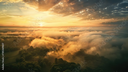 Breathtaking sunrise over a foggy landscape - Witness the awe-inspiring beauty of a majestic sunrise unfolding over a serene fog-covered landscape, evoking a sense of calm wonder © Tida