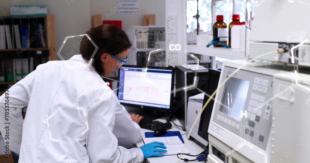 Image of chemical formulas over caucasian female lab worker using computer Image of chemical formulas over caucasian female lab worker using computer