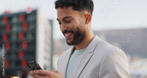 Phone, smile and happy businessman walking in a city with social media, scroll or web chat outdoor. Smartphone, travel and entrepreneur outside with app research, email or b2b client communication photo