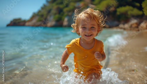 little child running on the beach, summer time, vacation time, water splash photo