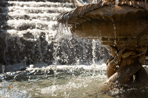 detail of an old classic style stone fountain . selective focus .High quality photo