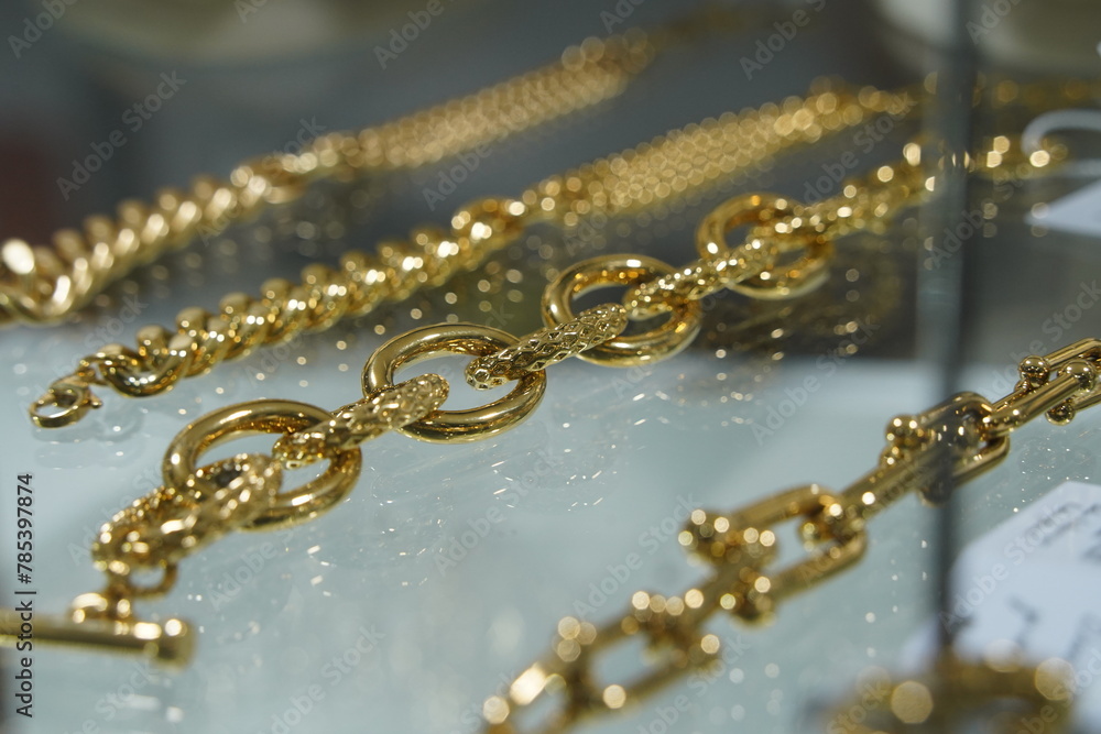 Different gold chains on the stand. Different gold chains on the stand.