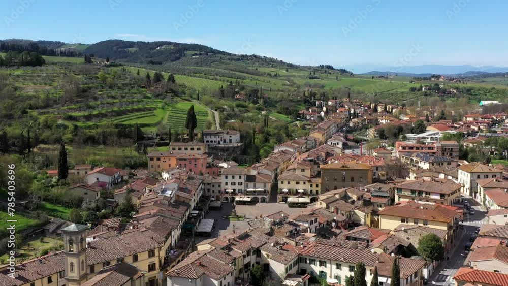 Aerial drone view of Greve in Chianti main square in Tuscany, south of Florence, central Italy, in a beautiful sunny spring day, with the main square. Aerial drone view of Greve in Chianti main square in Tuscany, south of Florence, central Italy, in a beautiful sunny spring day, with the main square.