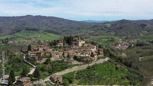 Drone aerial view of Montefioralle town, just above Greve in Chianti, a medieval village made with local stone in Chianti Classico region in a beautiful spring day surrounded by forests. photo
