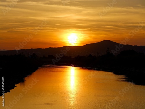 Sunset on the water channel, Mediterranian cost of Spain, El Grao de Castellon, Valencia, Spain © Yaroslav Ivanovych
