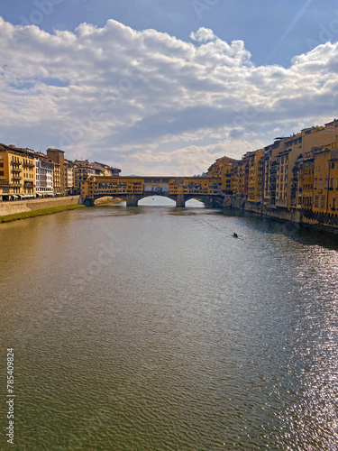 View from the Ponte Vecchio over the Arno river, in the ancient medieval city of Florence, Italy.