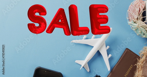 Image of sale text over travel equipment and plane