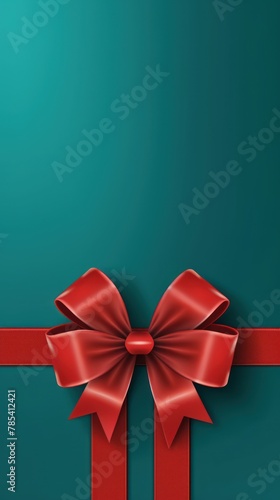 Red ribbon with bow on teal background, Christmas card concept. Space for text. Red and Teal Background