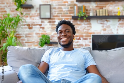  Man Watching TV with a Smile - Happy and Relaxed on Sofa at Home