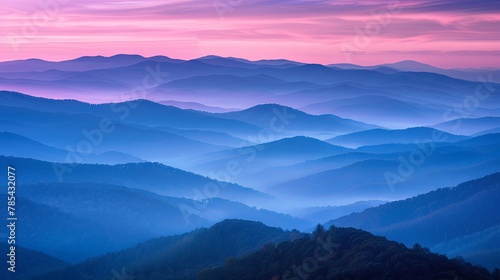 Serene twilight hues over layered mountain landscape
