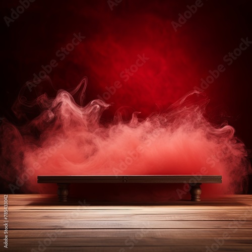 Red background with a wooden table and smoke. Space for product presentation
