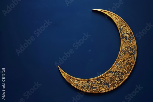 A gold and silver crescent moon is on a blue background